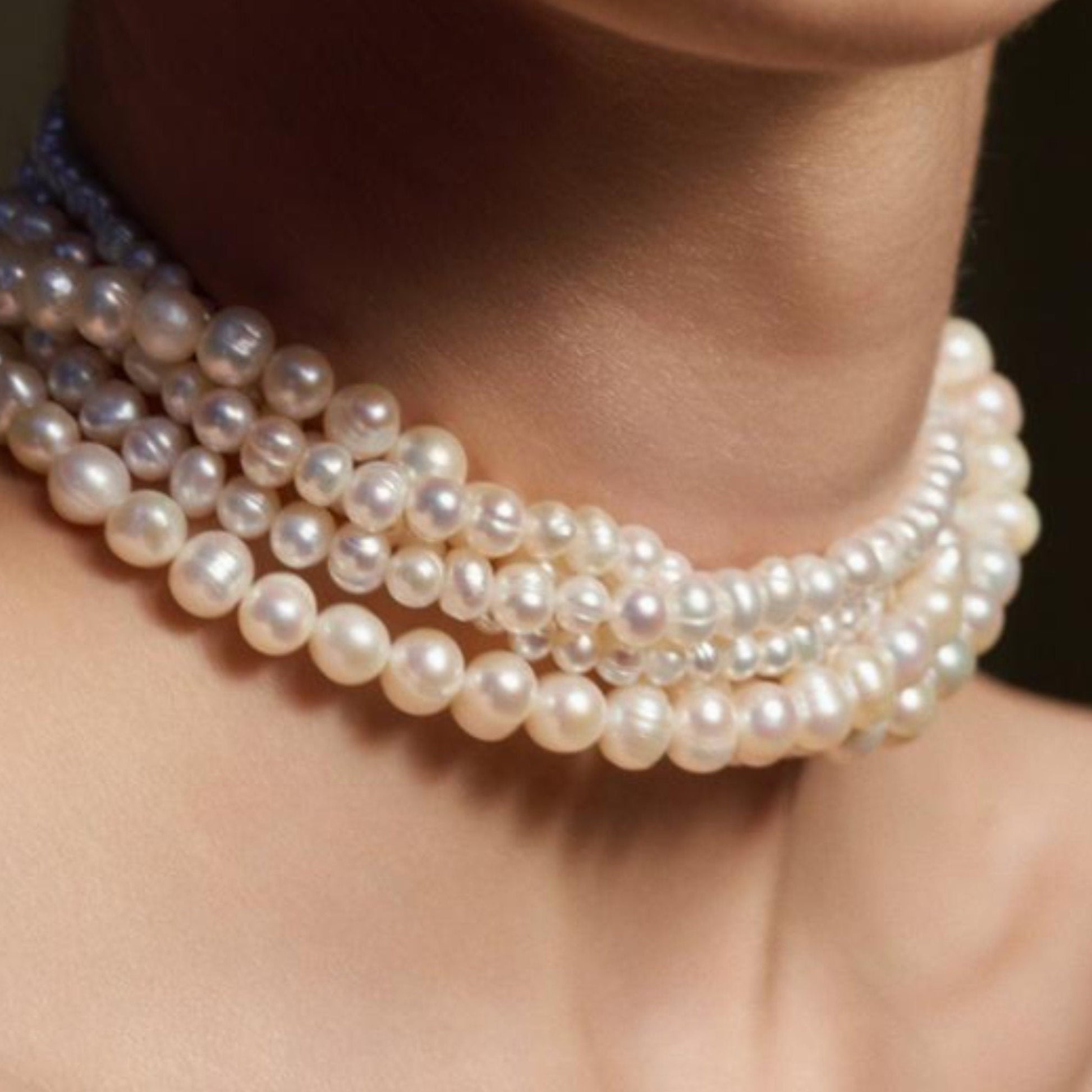 multi layered pearl choker necklace on the model with mixed round freshwater cultured pearls, includes a sterling silver clasp